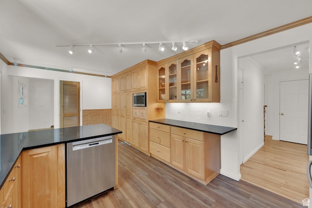 2967 E Branch Dr S, Holladay, UT 84117 - kitchen with stainless steel appliances, dark countertops, track lighting, light brown cabinetry, and ornamental molding