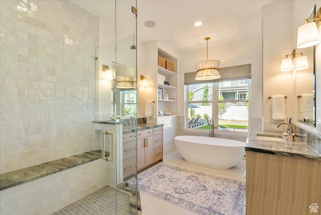 812 N 780 W, American Fork, UT 84003 - full bath featuring tile walls, tile patterned floors, a shower stall, vanity, and a freestanding tub
