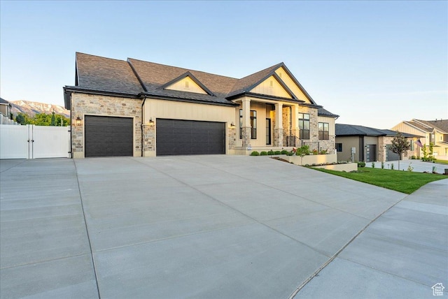 812 N 780 W, American Fork, UT 84003 - modern home with a garage, a gate, stone siding, and driveway