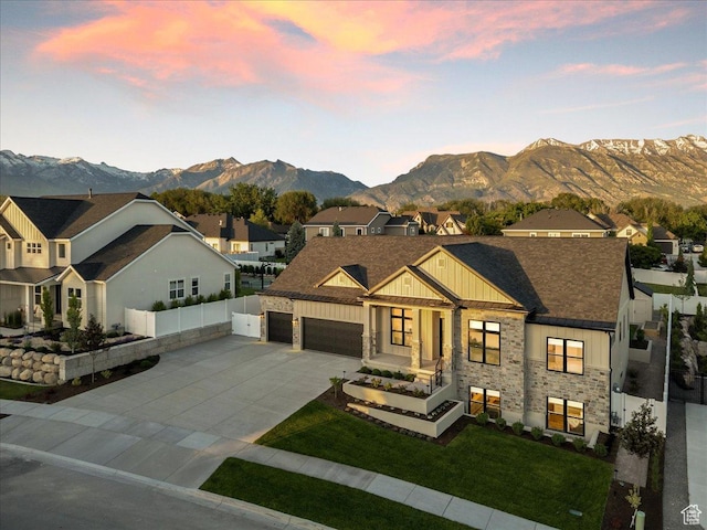 812 N 780 W, American Fork, UT 84003 - view of front of house with board and batten siding, concrete driveway, a mountain view, a residential view, and stone siding