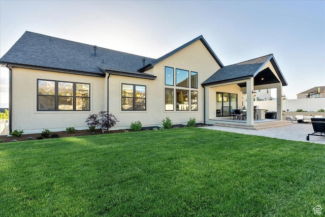 812 N 780 W, American Fork, UT 84003 - rear view of house with a patio, stucco siding, and a shingled roof