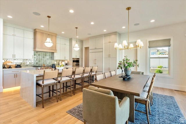 812 N 780 W, American Fork, UT 84003 - dining room featuring light wood-type flooring, a chandelier, and recessed lighting