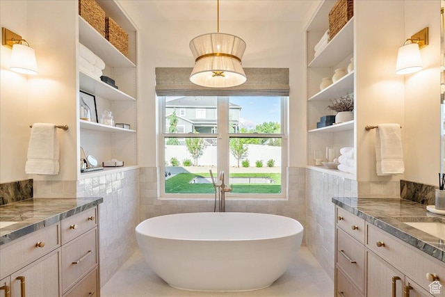 812 N 780 W, American Fork, UT 84003 - bathroom with tile walls, vanity, a freestanding bath, tile patterned floors, and a wainscoted wall