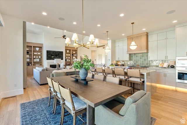 812 N 780 W, American Fork, UT 84003 - dining room featuring light wood-type flooring, a chandelier, and recessed lighting