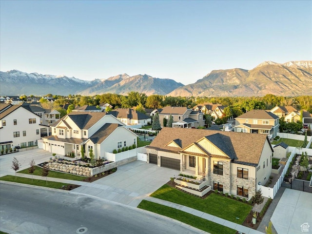 812 N 780 W, American Fork, UT 84003 - view of front of house featuring a residential view, driveway, stone siding, a mountain view, and an attached garage