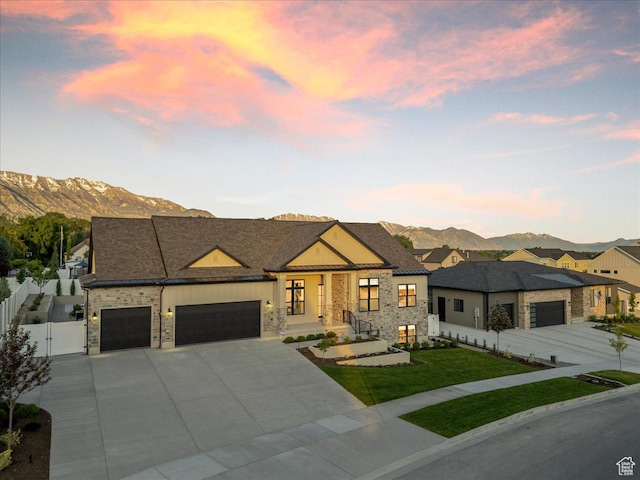 812 N 780 W, American Fork, UT 84003 - modern home with a mountain view, an attached garage, stone siding, a gate, and concrete driveway