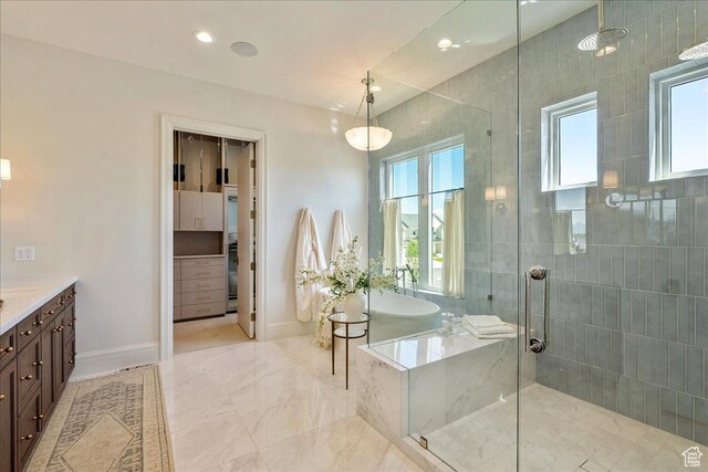 807 N 780 W, American Fork, UT 84003 - bathroom with vanity, a shower stall, a bath, baseboards, and recessed lighting