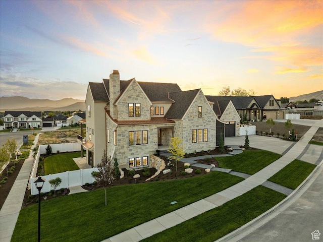 807 N 780 W, American Fork, UT 84003 - french country home with stone siding, driveway, a garage, a chimney, and a standing seam roof