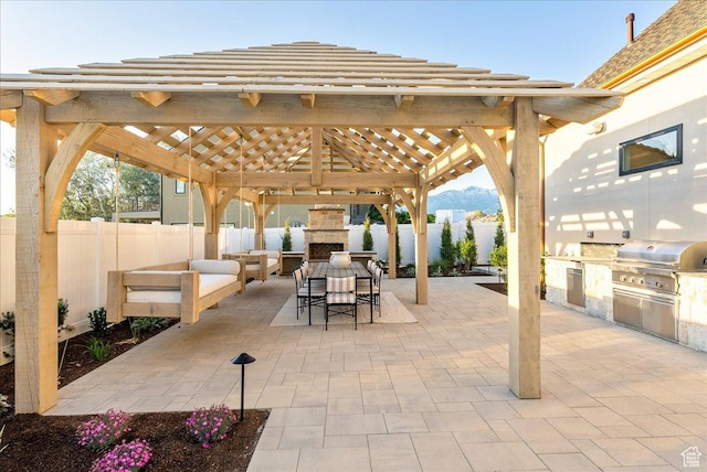 807 N 780 W, American Fork, UT 84003 - fenced backyard featuring an outdoor stone fireplace, a gazebo, a patio area, a mountain view, and outdoor dining area
