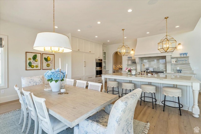 807 N 780 W, American Fork, UT 84003 - dining area featuring light wood finished floors, recessed lighting, a chandelier, and baseboards