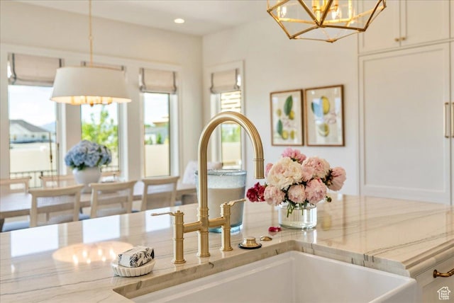 807 N 780 W, American Fork, UT 84003 - detailed view of a chandelier, a sink, white cabinetry, decorative light fixtures, and recessed lighting
