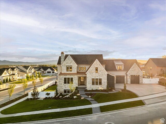 807 N 780 W, American Fork, UT 84003 - french country home featuring stone siding, concrete driveway, a residential view, and a chimney