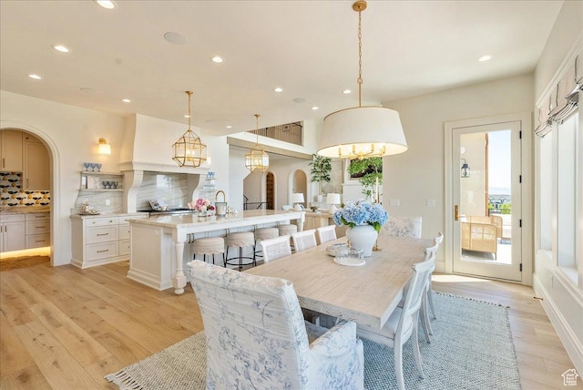 807 N 780 W, American Fork, UT 84003 - dining room featuring recessed lighting, light wood-style flooring, and arched walkways