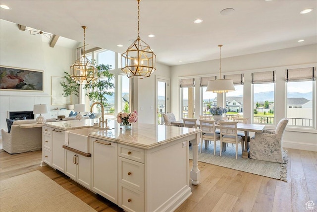 807 N 780 W, American Fork, UT 84003 - kitchen with a sink, a chandelier, light wood-type flooring, open floor plan, and recessed lighting