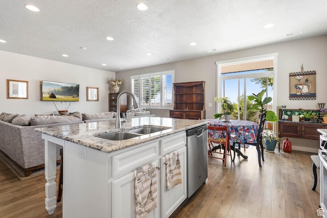 1165 W Silver Hollow Rd, Syracuse, UT 84075 - kitchen featuring a sink, dishwasher, recessed lighting, white cabinets, and hardwood / wood-style flooring