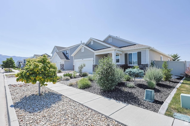 1165 W Silver Hollow Rd, Syracuse, UT 84075 - view of front of property featuring stone siding and an attached garage
