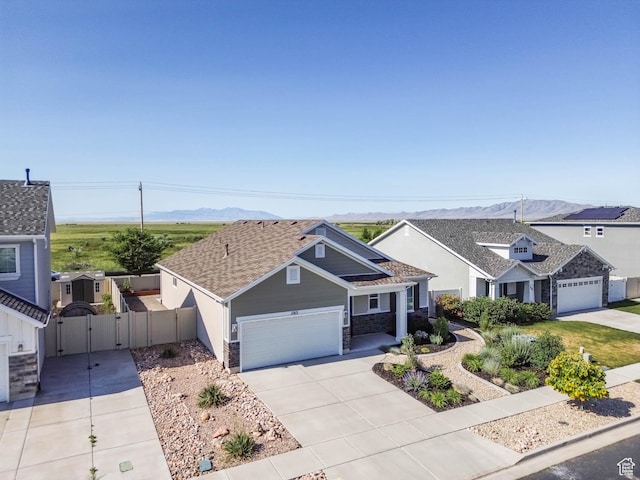 1165 W Silver Hollow Rd, Syracuse, UT 84075 - view of front facade with a gate, driveway, a garage, and a mountain view