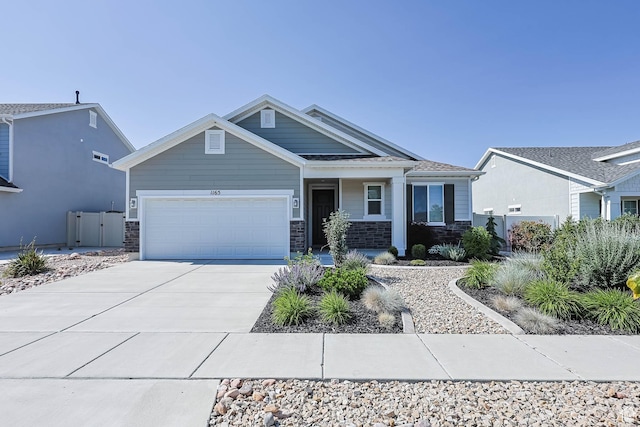 1165 W Silver Hollow Rd, Syracuse, UT 84075 - craftsman-style home featuring an attached garage, concrete driveway, and stone siding