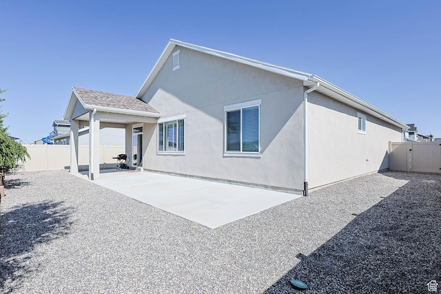 1165 W Silver Hollow Rd, Syracuse, UT 84075 - back of house with a patio area and stucco siding