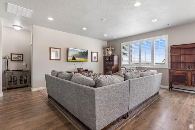 1165 W Silver Hollow Rd, Syracuse, UT 84075 - living room featuring a textured ceiling, hardwood / wood-style flooring, recessed lighting, and baseboards