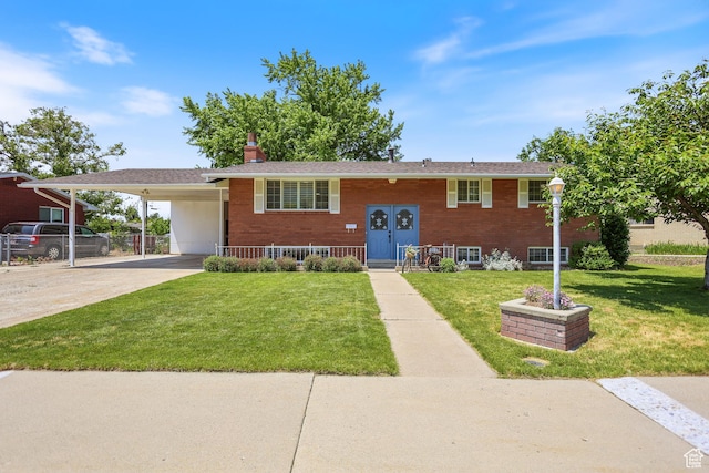 533 N 700 E, Orem, UT 84097 - bi-level home with concrete driveway, a carport, a chimney, and brick siding