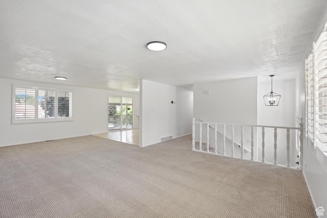 533 N 700 E, Orem, UT 84097 - carpeted spare room with a chandelier and a textured ceiling