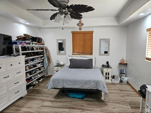 920 N 100 E, Pleasant Grove, UT 84062 - bedroom featuring a tray ceiling, crown molding, light wood-type flooring, baseboards, and ceiling fan