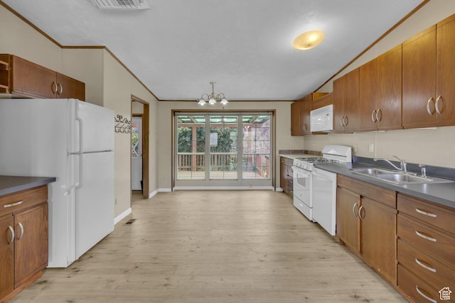 454 E 100 N, Moab, UT 84532 - kitchen with a sink, white appliances, light wood finished floors, brown cabinets, and a chandelier