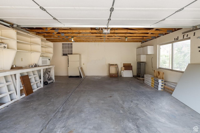 454 E 100 N, Moab, UT 84532 - garage featuring freestanding refrigerator and a garage door opener
