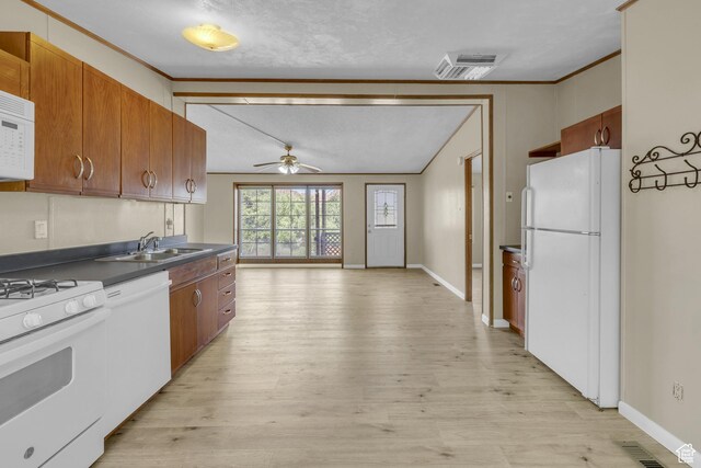 454 E 100 N, Moab, UT 84532 - kitchen featuring white appliances, ceiling fan, dark countertops, light wood-type flooring, and a sink