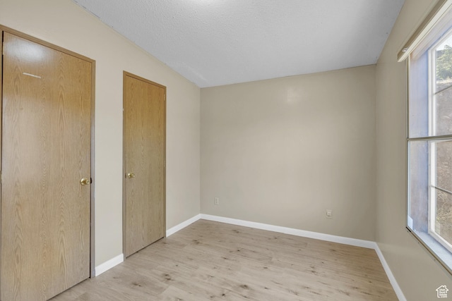 454 E 100 N, Moab, UT 84532 - unfurnished bedroom featuring light wood finished floors and baseboards