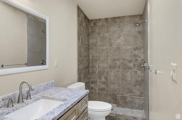 454 E 100 N, Moab, UT 84532 - bathroom featuring toilet, a tile shower, and vanity