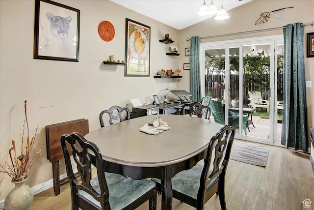 1422 N Fowler Ave E, Ogden, UT 84404 - dining area featuring light wood-type flooring, lofted ceiling, and baseboards
