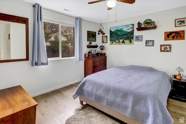 1422 N Fowler Ave E, Ogden, UT 84404 - bedroom with wood finished floors, baseboards, and a ceiling fan