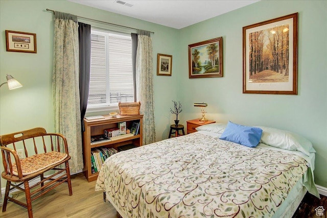 1422 N Fowler Ave E, Ogden, UT 84404 - bedroom featuring light wood finished floors and baseboards