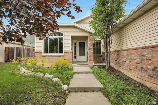 1422 N Fowler Ave E, Ogden, UT 84404 - doorway to property featuring brick siding