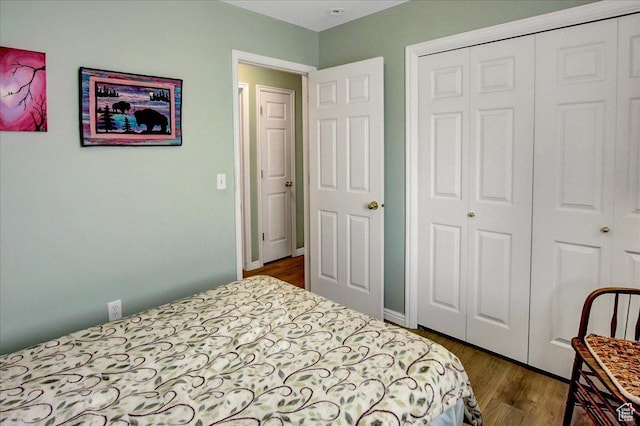 1422 N Fowler Ave E, Ogden, UT 84404 - bedroom featuring a closet and dark wood finished floors