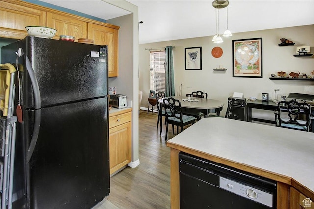 1422 N Fowler Ave E, Ogden, UT 84404 - kitchen with black appliances, light wood finished floors, light countertops, pendant lighting, and baseboards