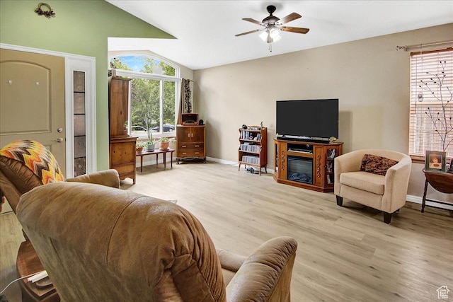 1422 N Fowler Ave E, Ogden, UT 84404 - living room featuring light wood finished floors, baseboards, a ceiling fan, and lofted ceiling