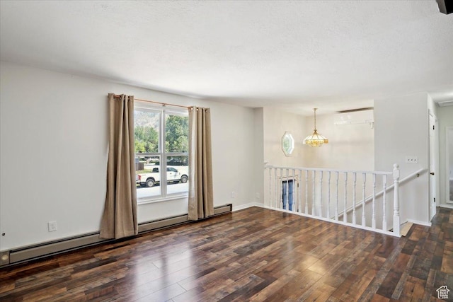 263 W 800 N, Brigham City, UT 84302 - empty room featuring wood finished floors, a textured ceiling, and baseboards