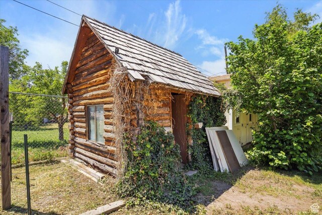 263 W 800 N, Brigham City, UT 84302 - view of side of property featuring log exterior and an outdoor structure