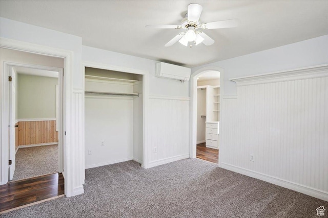 263 W 800 N, Brigham City, UT 84302 - unfurnished bedroom with carpet, wainscoting, a closet, a wall unit AC, and arched walkways
