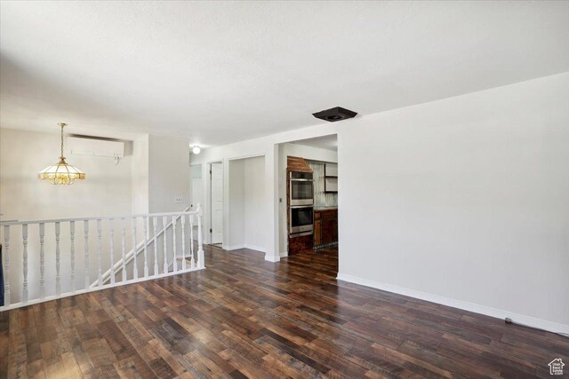 263 W 800 N, Brigham City, UT 84302 - spare room with a wall mounted AC, wood finished floors, and baseboards