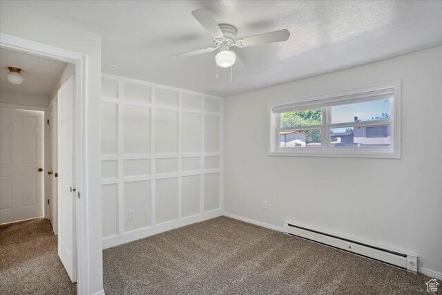 263 W 800 N, Brigham City, UT 84302 - carpeted empty room featuring a baseboard radiator, a ceiling fan, and baseboards