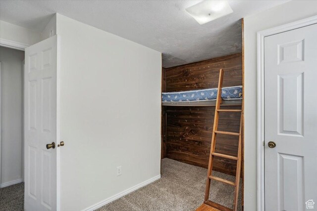 263 W 800 N, Brigham City, UT 84302 - unfurnished bedroom with carpet, baseboards, and a textured ceiling