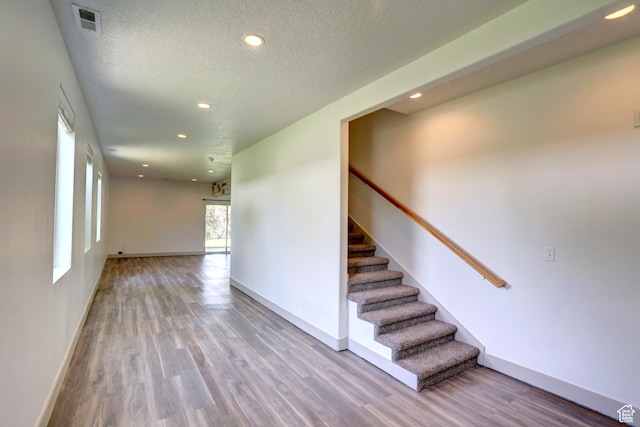247 E 700 N, Spanish Fork, UT 84660 - stairway featuring recessed lighting, wood finished floors, baseboards, and a textured ceiling