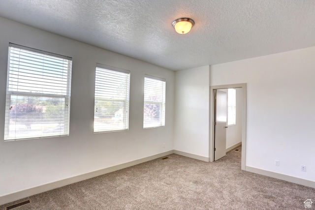 247 E 700 N, Spanish Fork, UT 84660 - empty room featuring light colored carpet, a textured ceiling, and baseboards