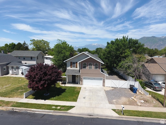 247 E 700 N, Spanish Fork, UT 84660 - traditional home featuring concrete driveway, a mountain view, a garage, and a residential view