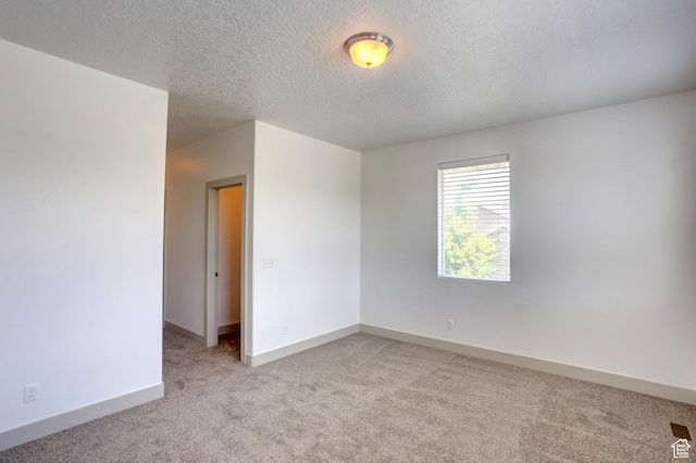 247 E 700 N, Spanish Fork, UT 84660 - unfurnished room featuring light colored carpet, a textured ceiling, and baseboards