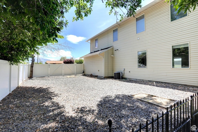 247 E 700 N, Spanish Fork, UT 84660 - back of property with a gate, cooling unit, and a fenced backyard